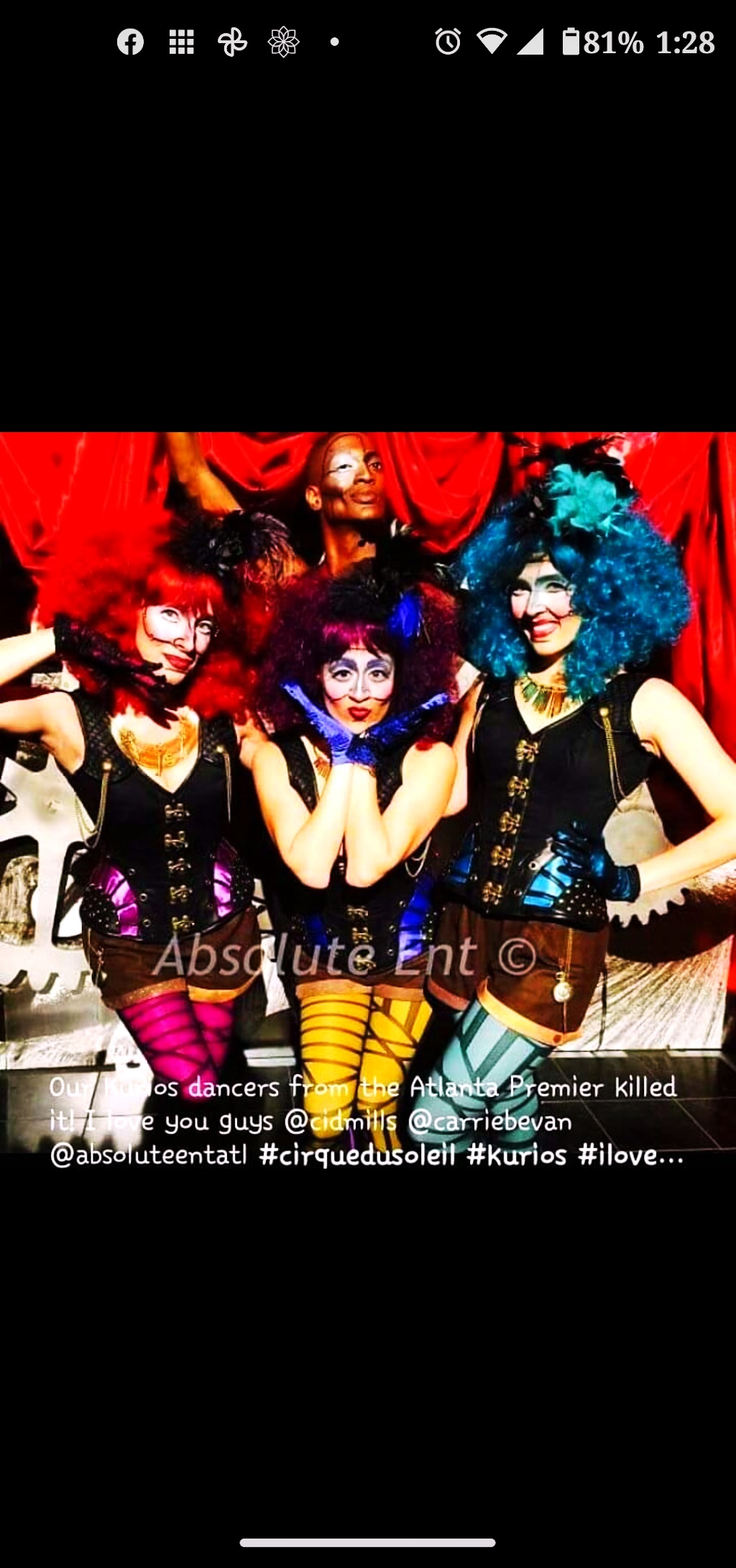 RikkiTheFool posing with the KURIOS cast in a backstage group photograph